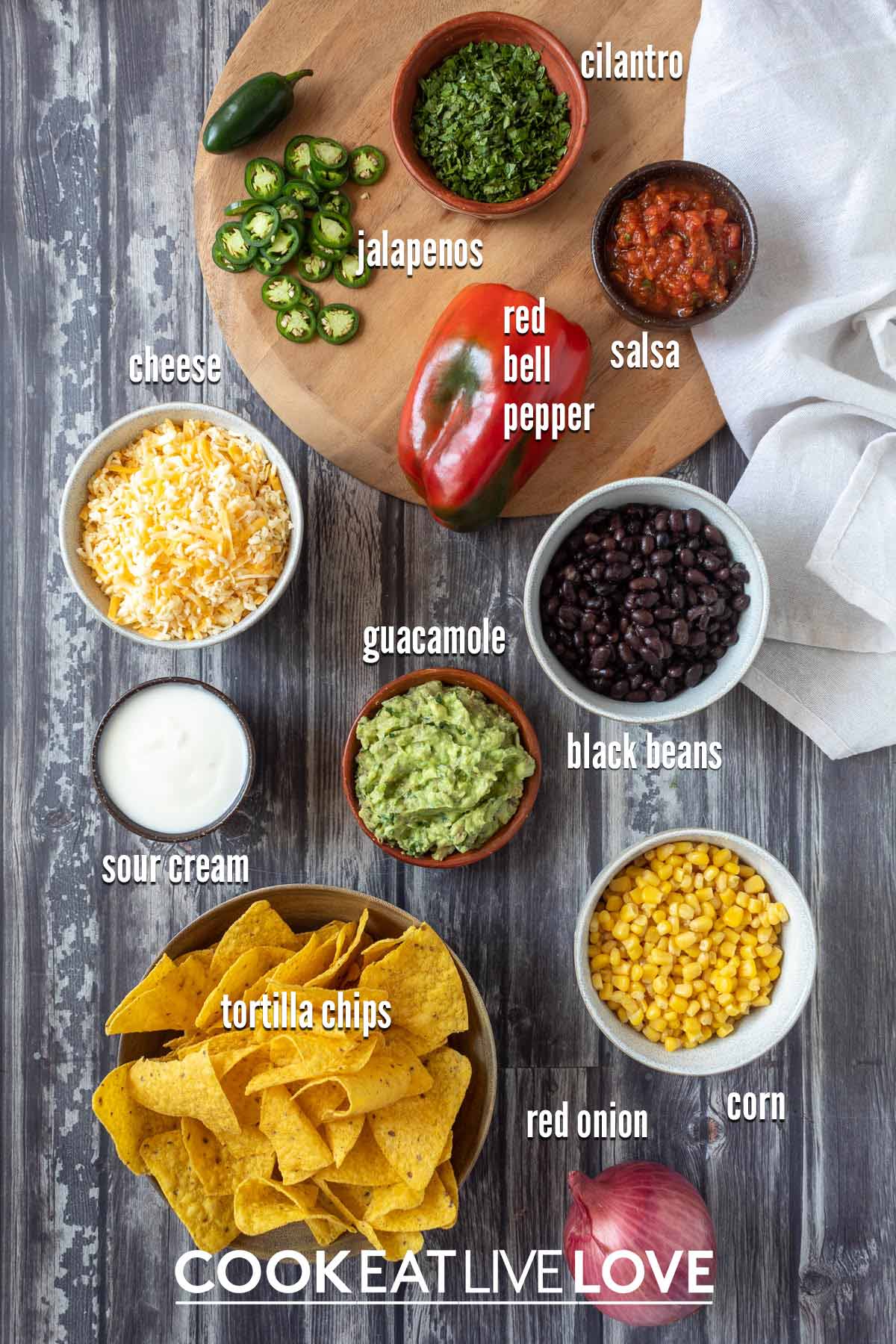 Ingredients to make loaded vegetarian nachos on the table.