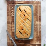 Pin for pinterest graphic with vegan wellington on a platter ready to serve and text on top.