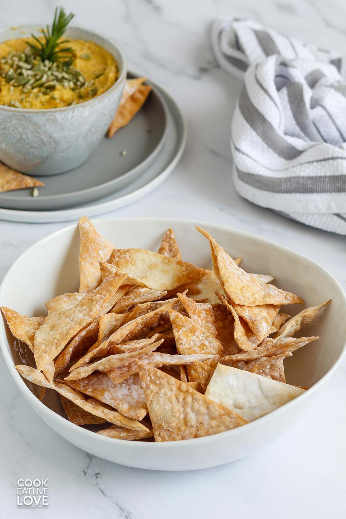 A bowl filled with wonton chips cooked in the air fryer.