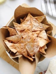 A basket filled with air fryer wonton chips.