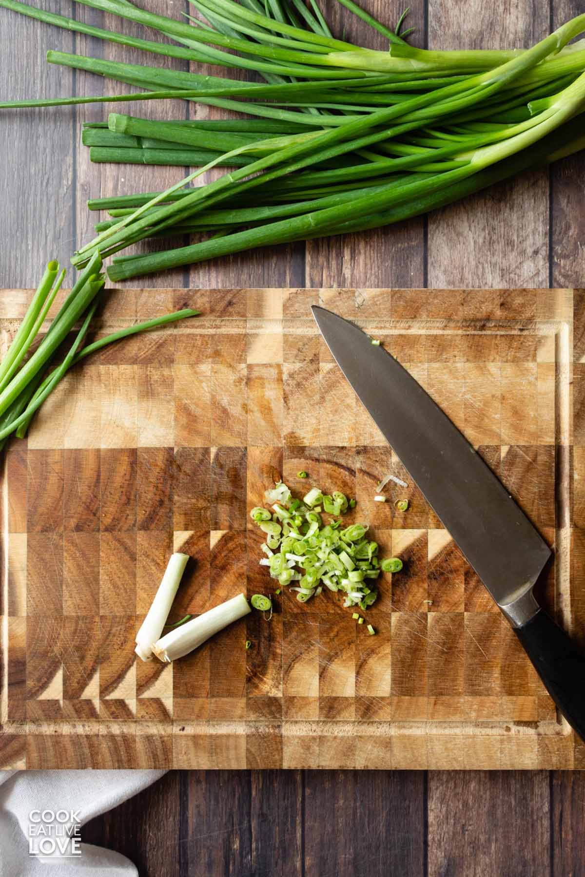 Minced green onions on the cutting board.