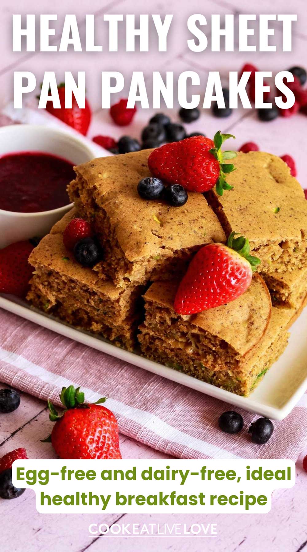Pin for Pinterest with Stack of vegan sheet pan pancakes covered with berries.