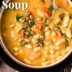 Pin for pinterest graphic with bowl of soup on the table and text on top.