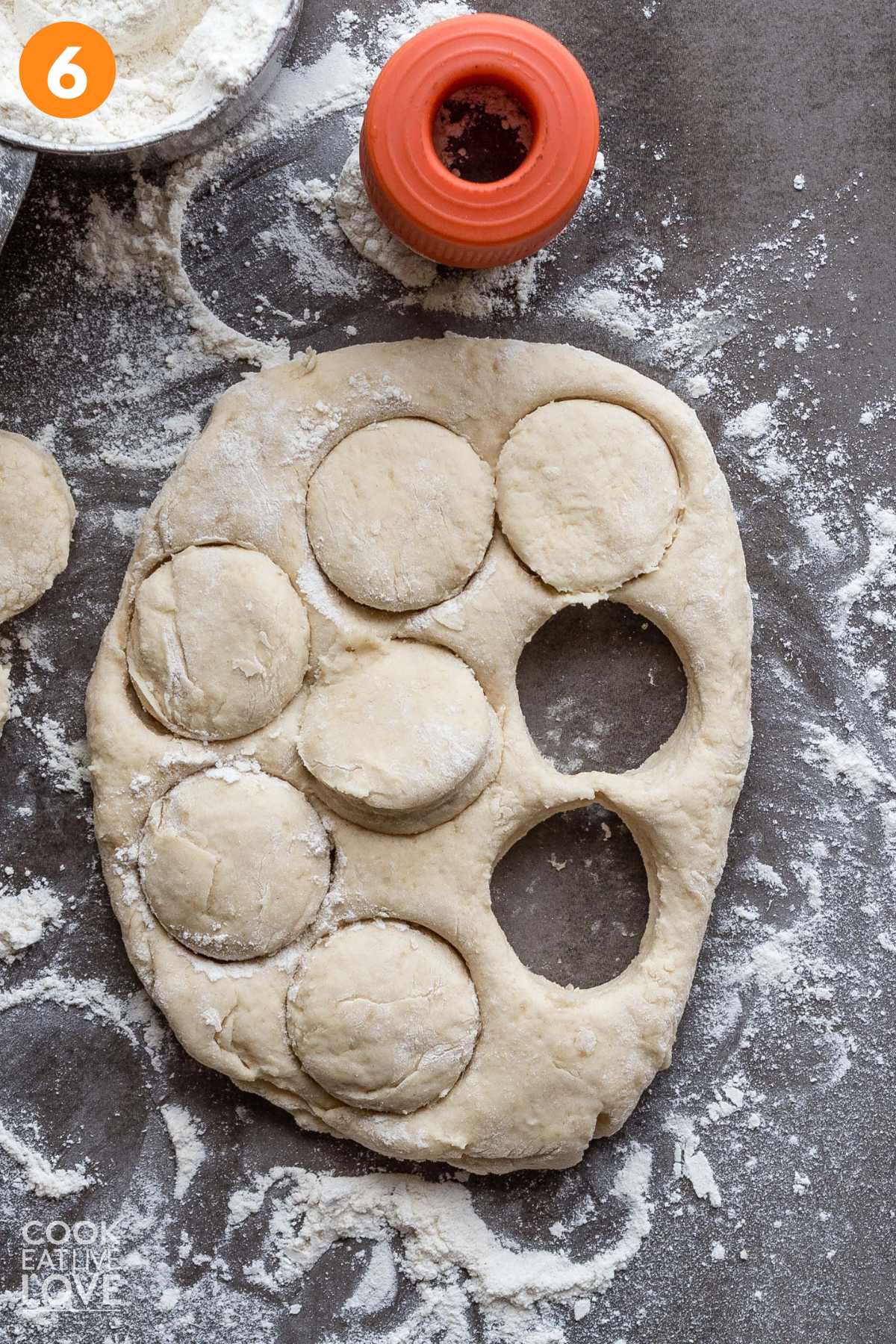 Dough rolled out on the work surface and cut with a biscuit cutter.