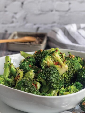 Broccoli and ginger on plate.