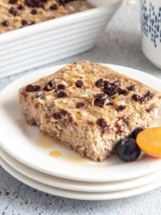 Single serve baked oatmeal in a small tart pan with blueberries.