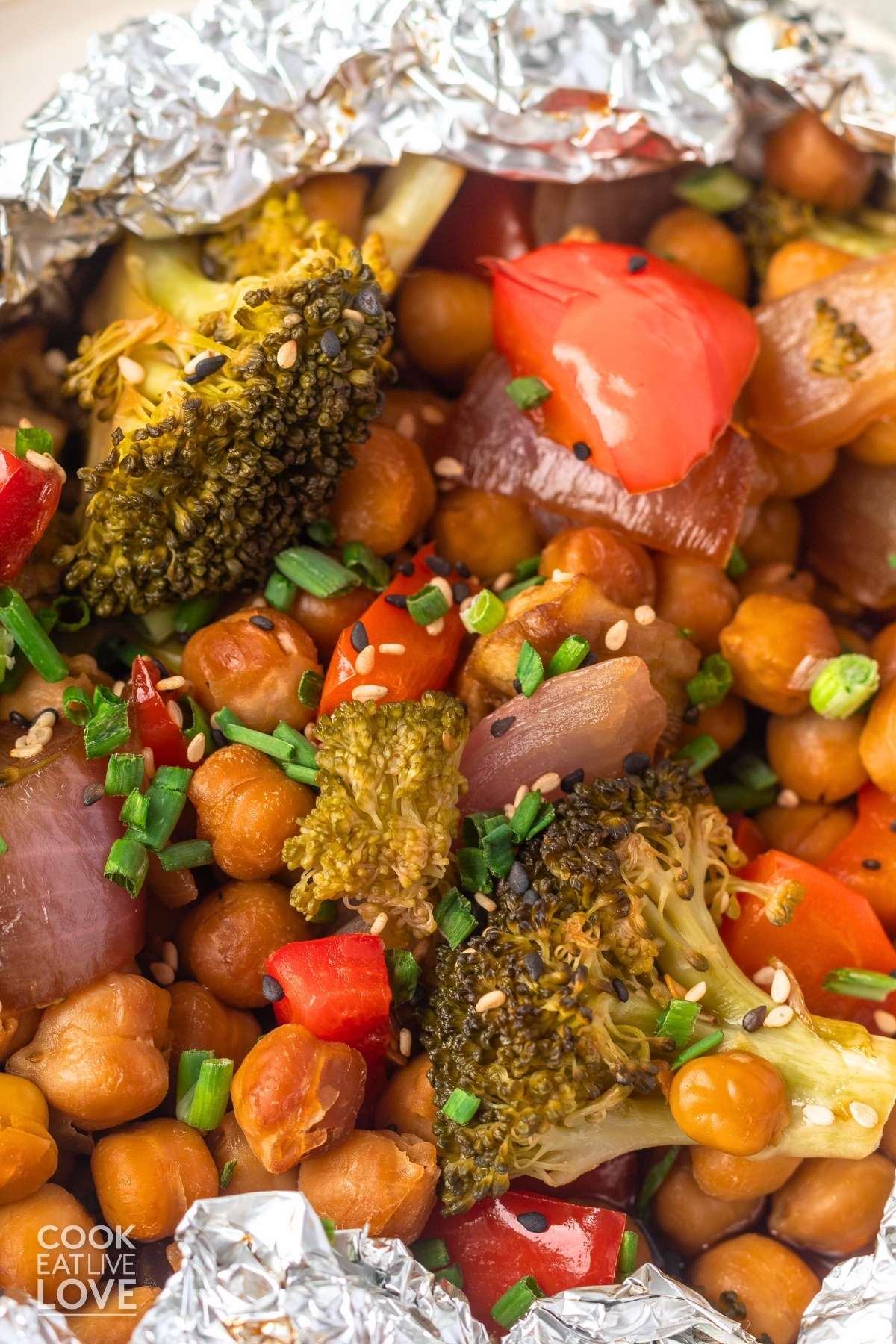 A close up view of cooked vegetables and chickpeas when foil pack is opened.
