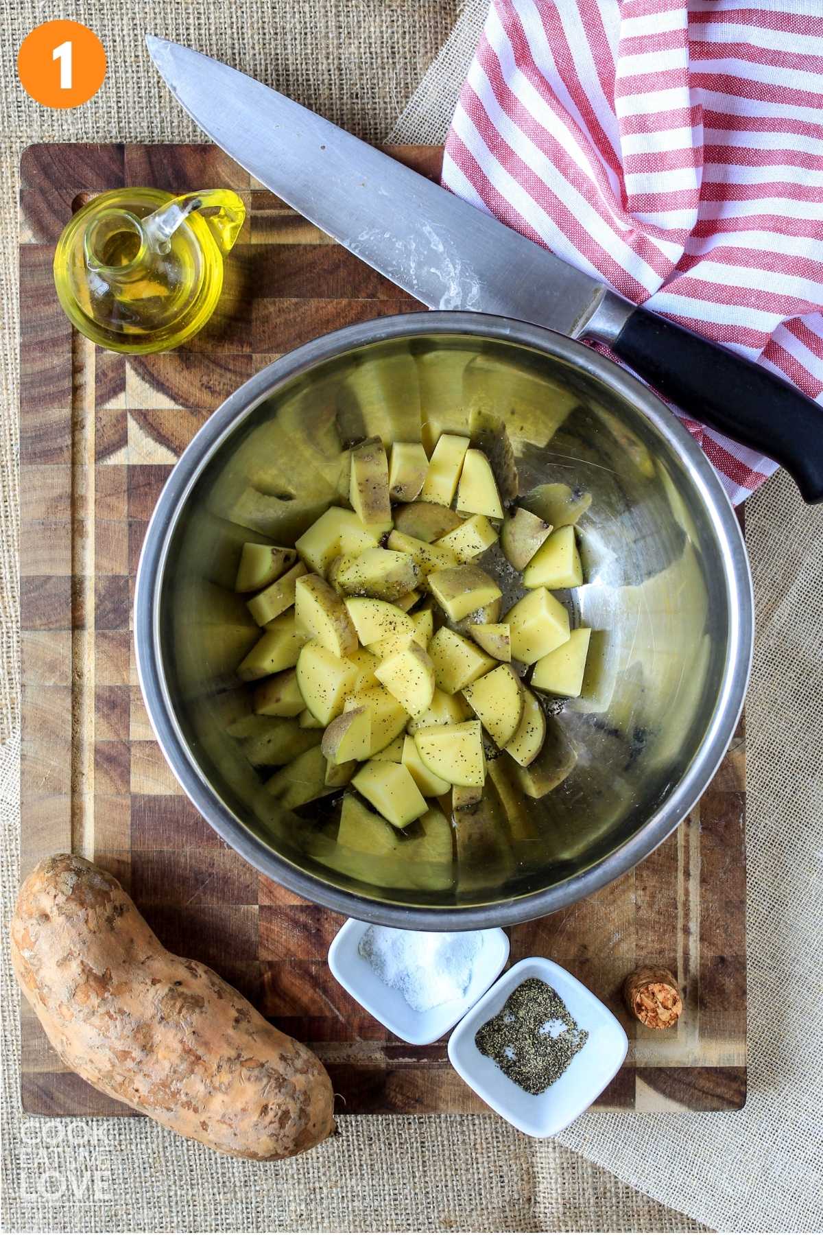 Cut potatoes in a bowl on a cutting board.