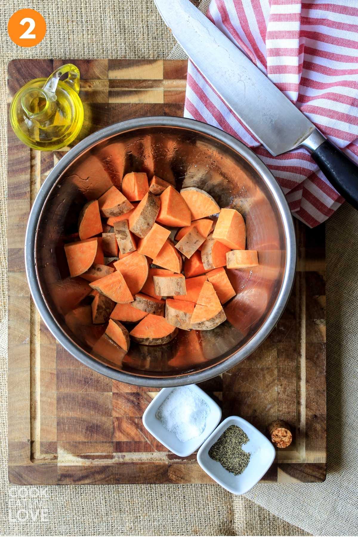 Cut sweet potatoes in a bowl on the counter.