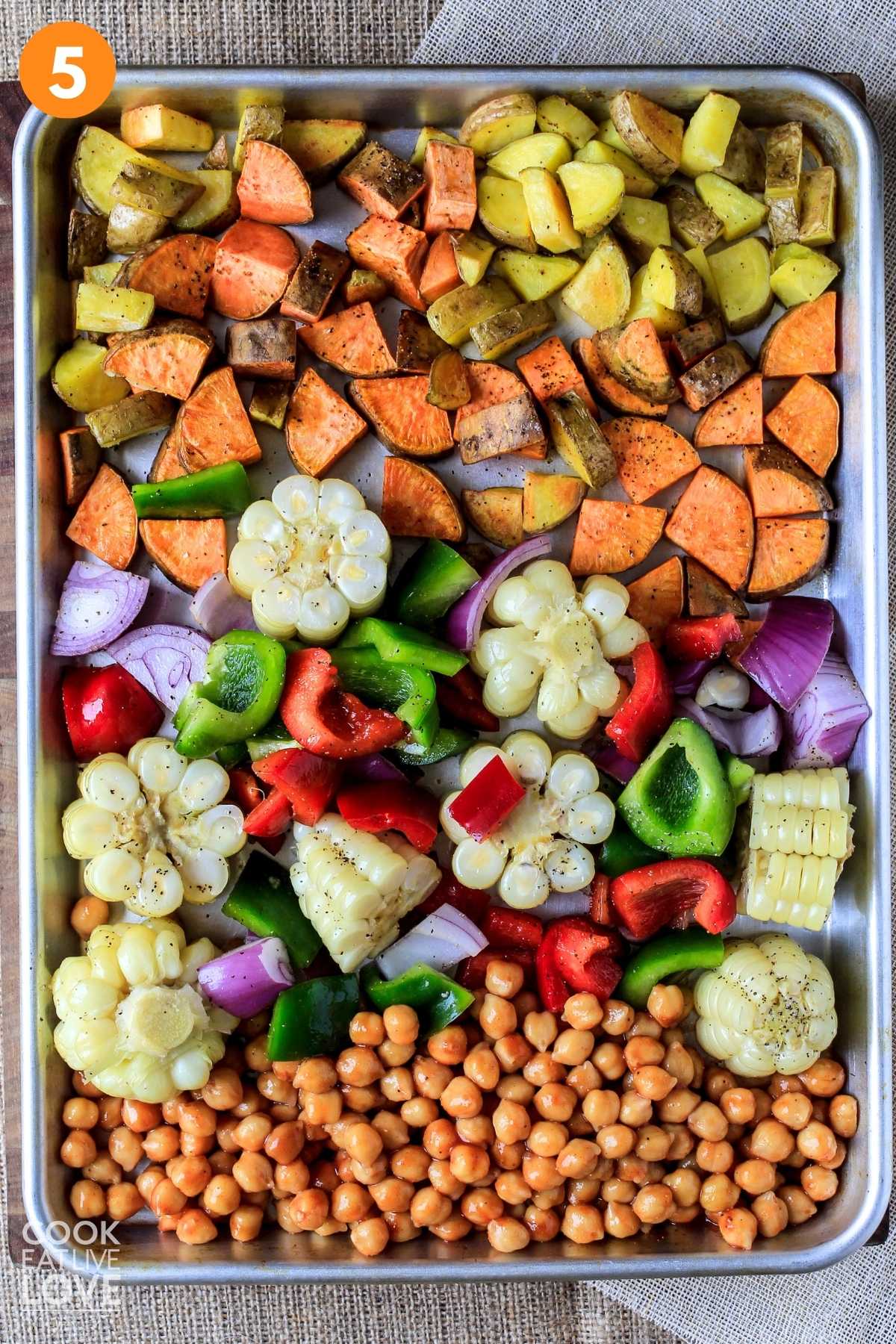 All the ingredients on the baking sheet to cook a chickpea bake.