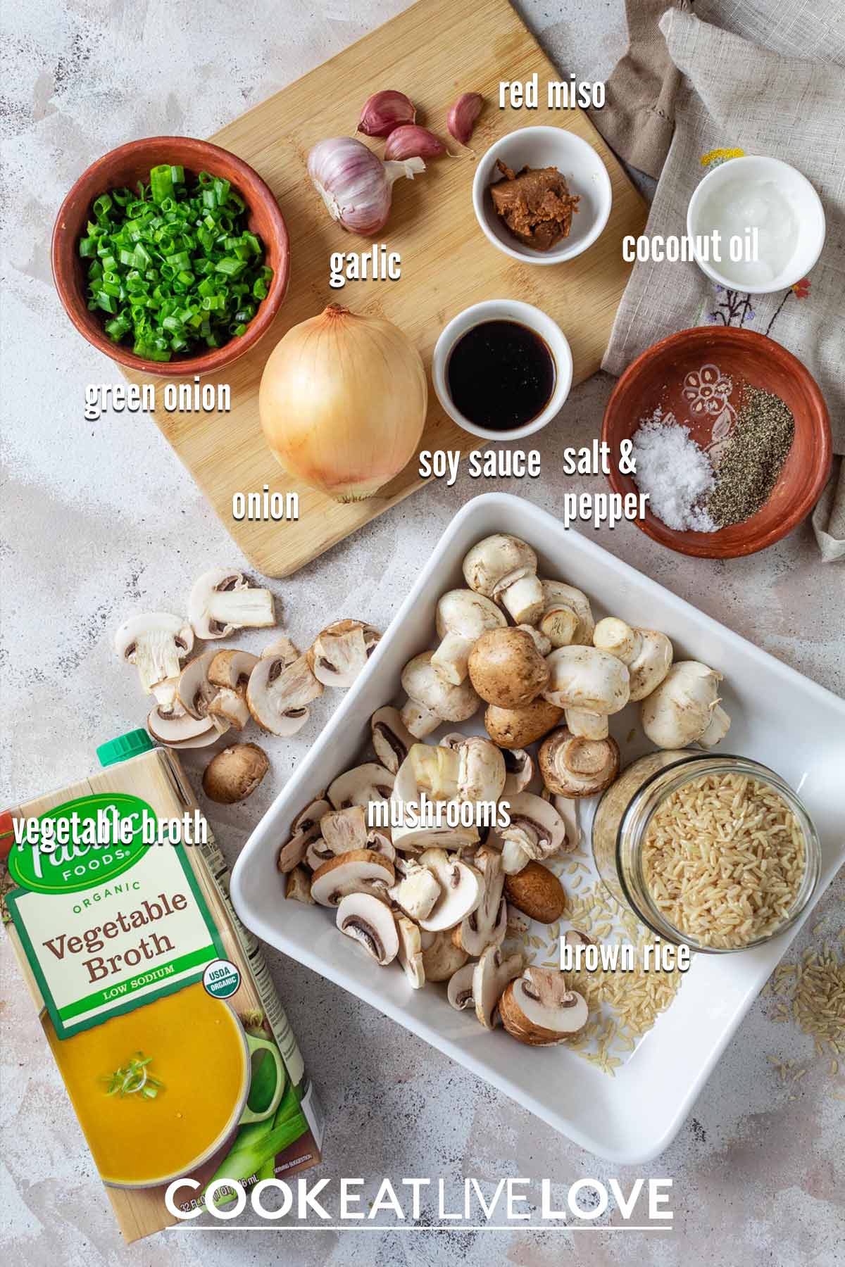 Ingredients to make mushroom brown rice casserole on the table with text labels.
