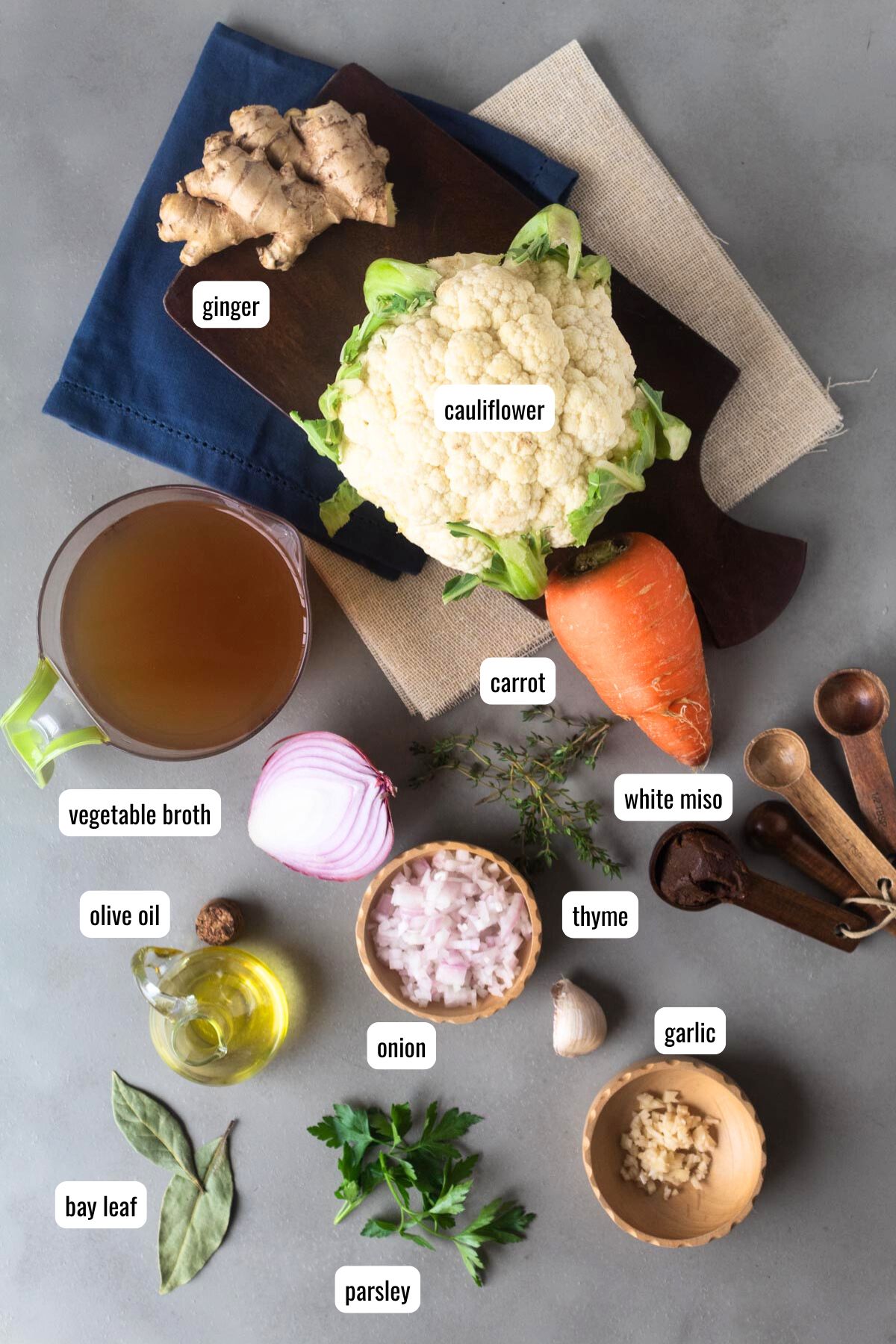 Ingredients to make cauliflower and carrot soup on the table.