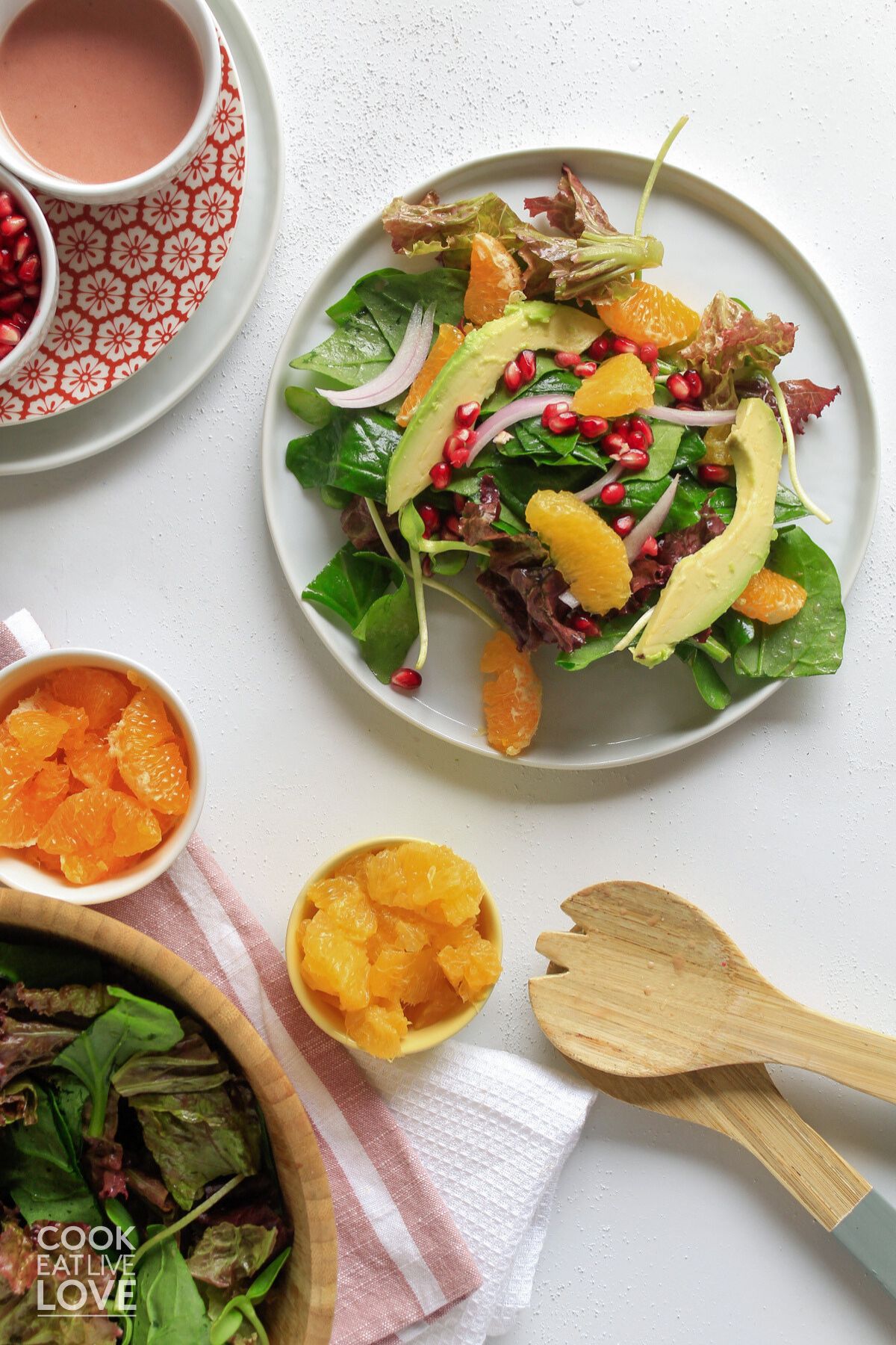 Citrus avocado salad on a white plate. 