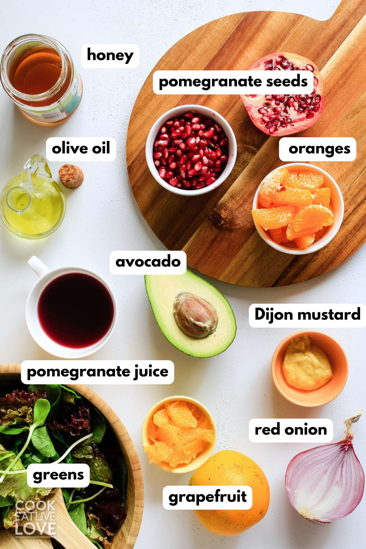 Ingredients for a citrus salad on table with text labels.