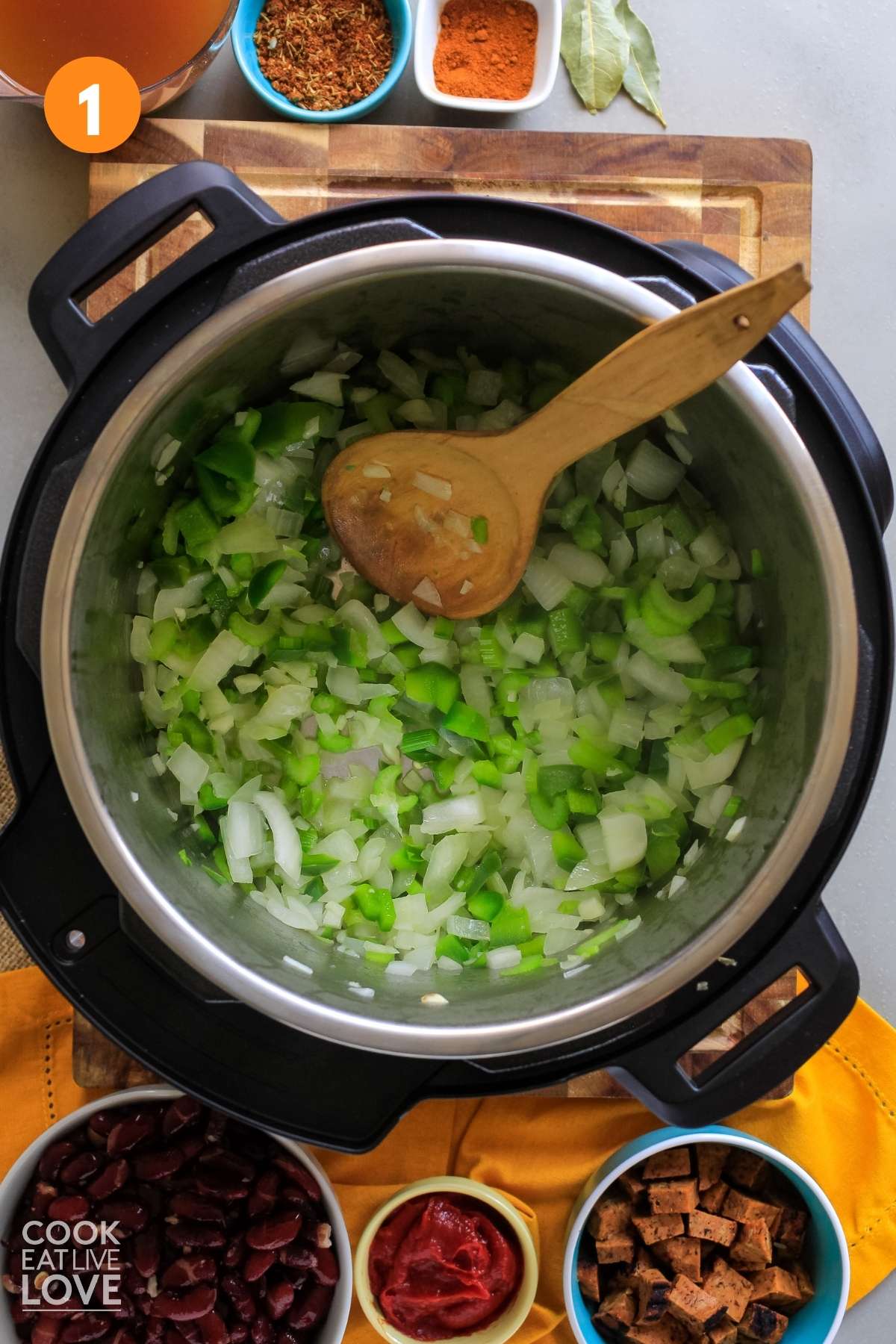 Onions, peppers and celery cooking in instant pot.