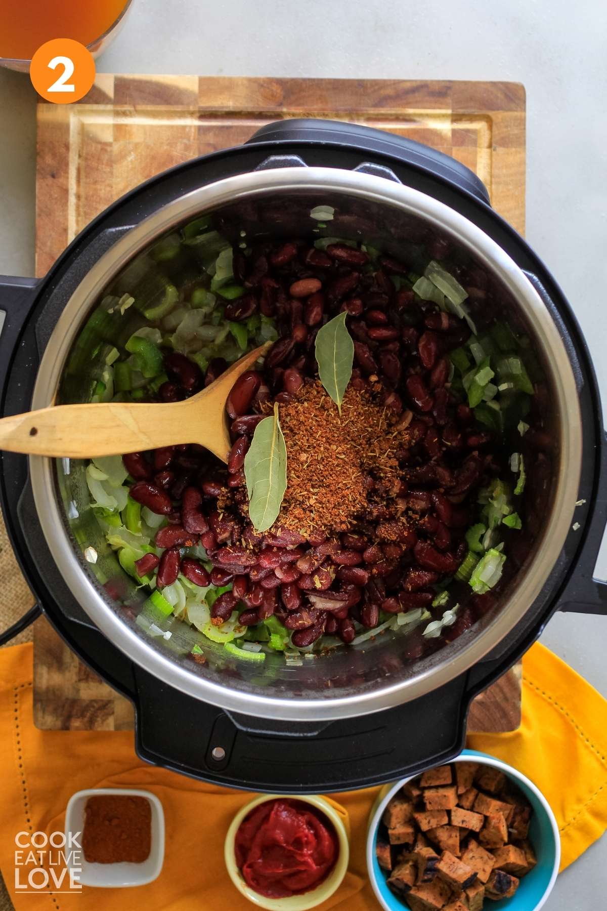 Beans, seasoning and broth added to the instant pot.