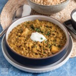 Lentil curry served up with vegan yogurt on the table