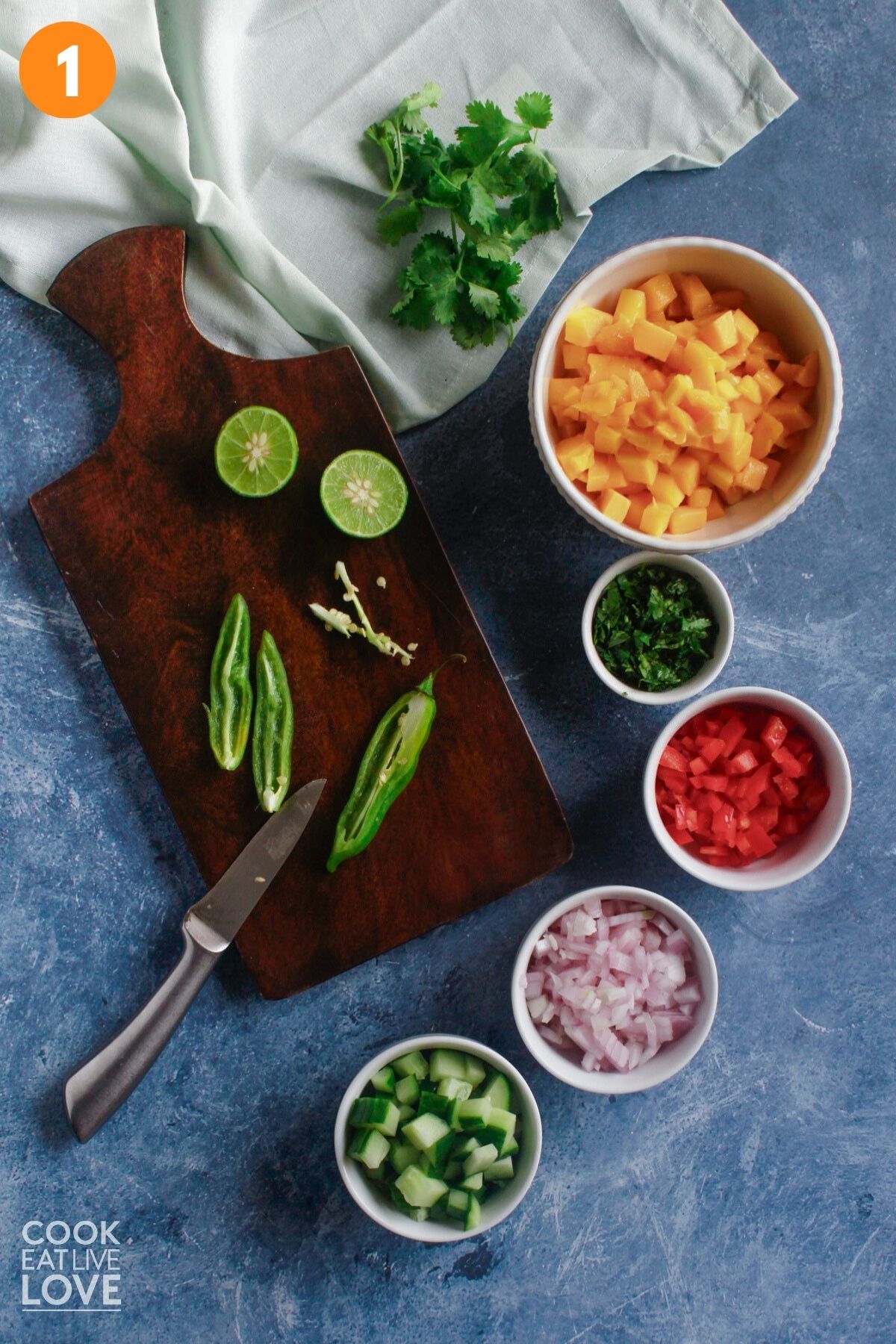 Cutting the spicy pepper for the salsa.