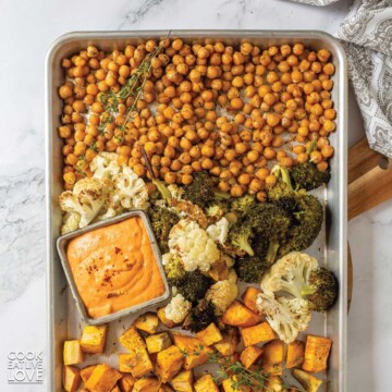 Mediterranean roasted vegetables on a baking sheet on the table.