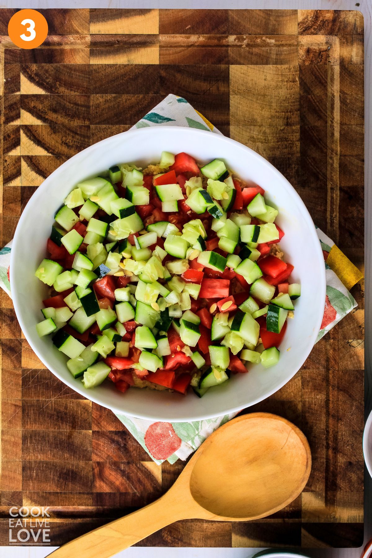 Cutting board with bell pepper and cucumber cut on surface, showing the size to chop.