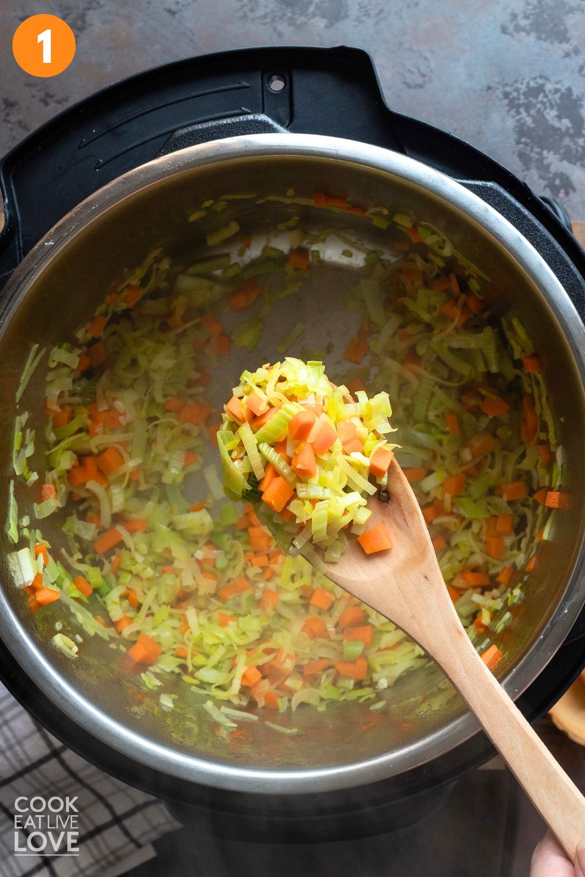 Cooking the veggies in lentil stew.