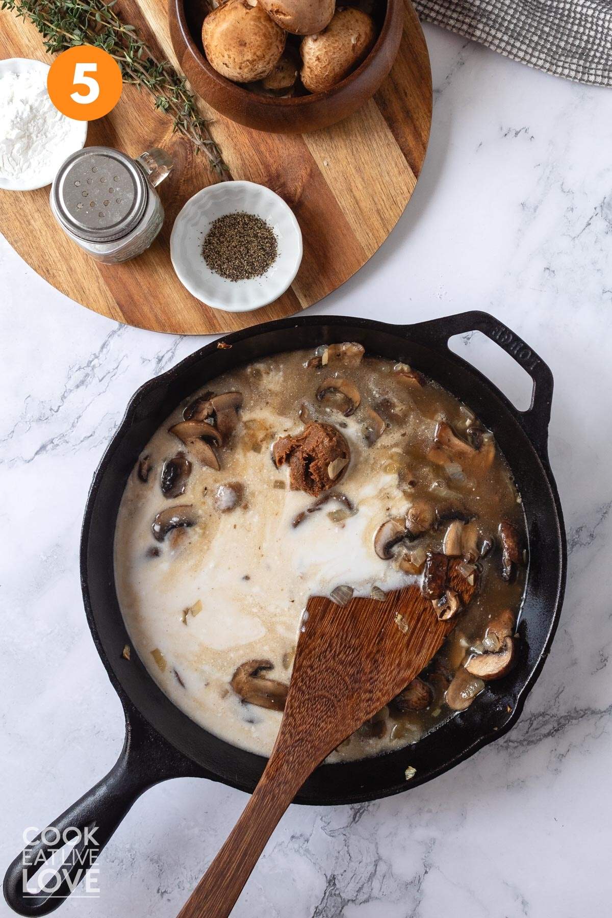 The miso and coconut milk is added to the skillet of mushroom sauce without cream.