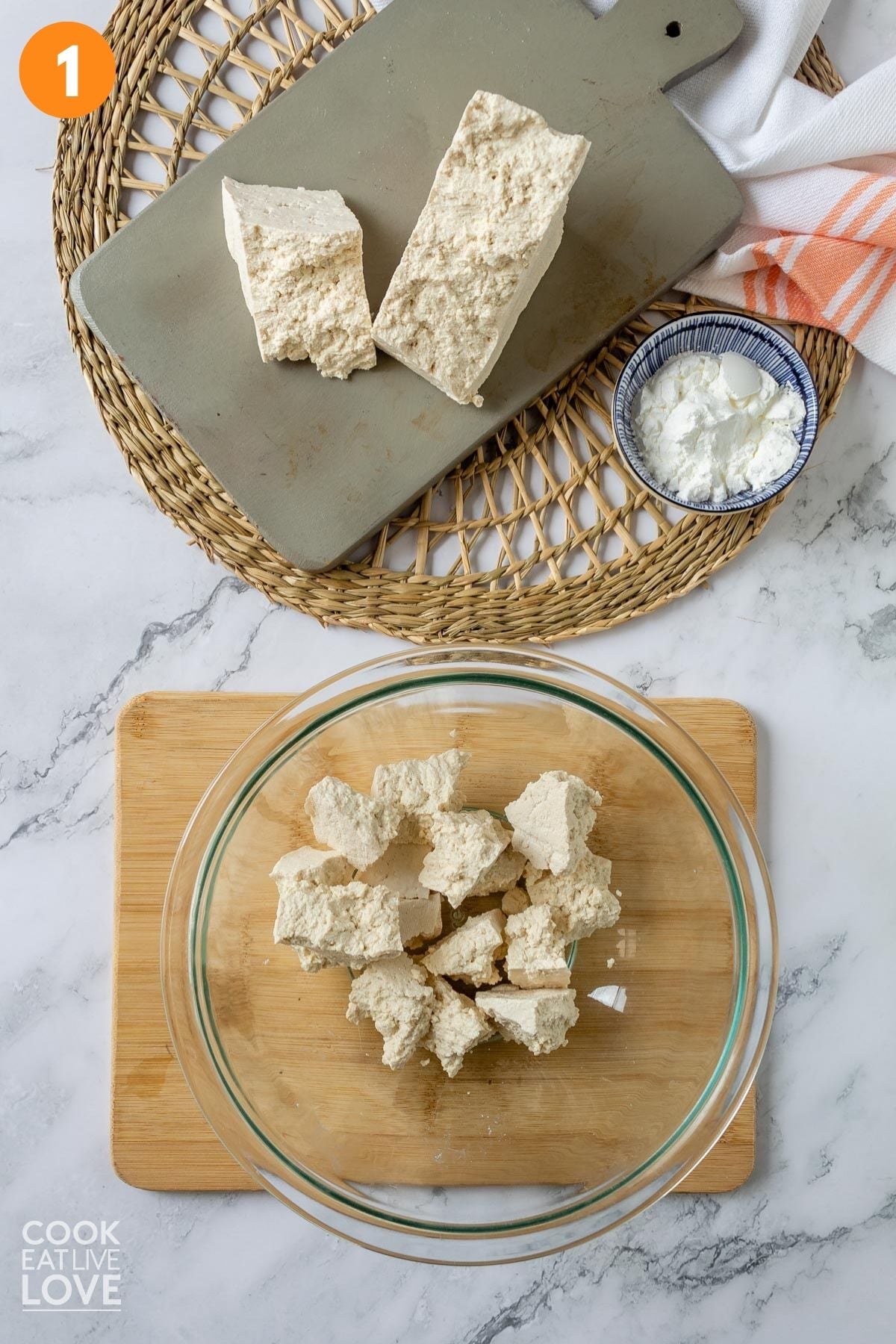 Tofu crumbled in a bowl.