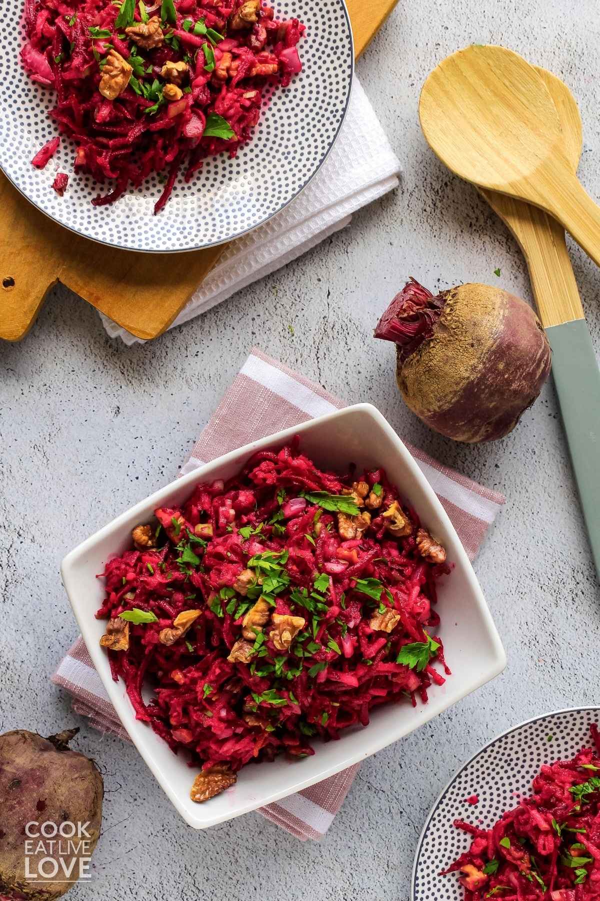 Beetroot and apple salad in rectangle bowl and on a plate. 