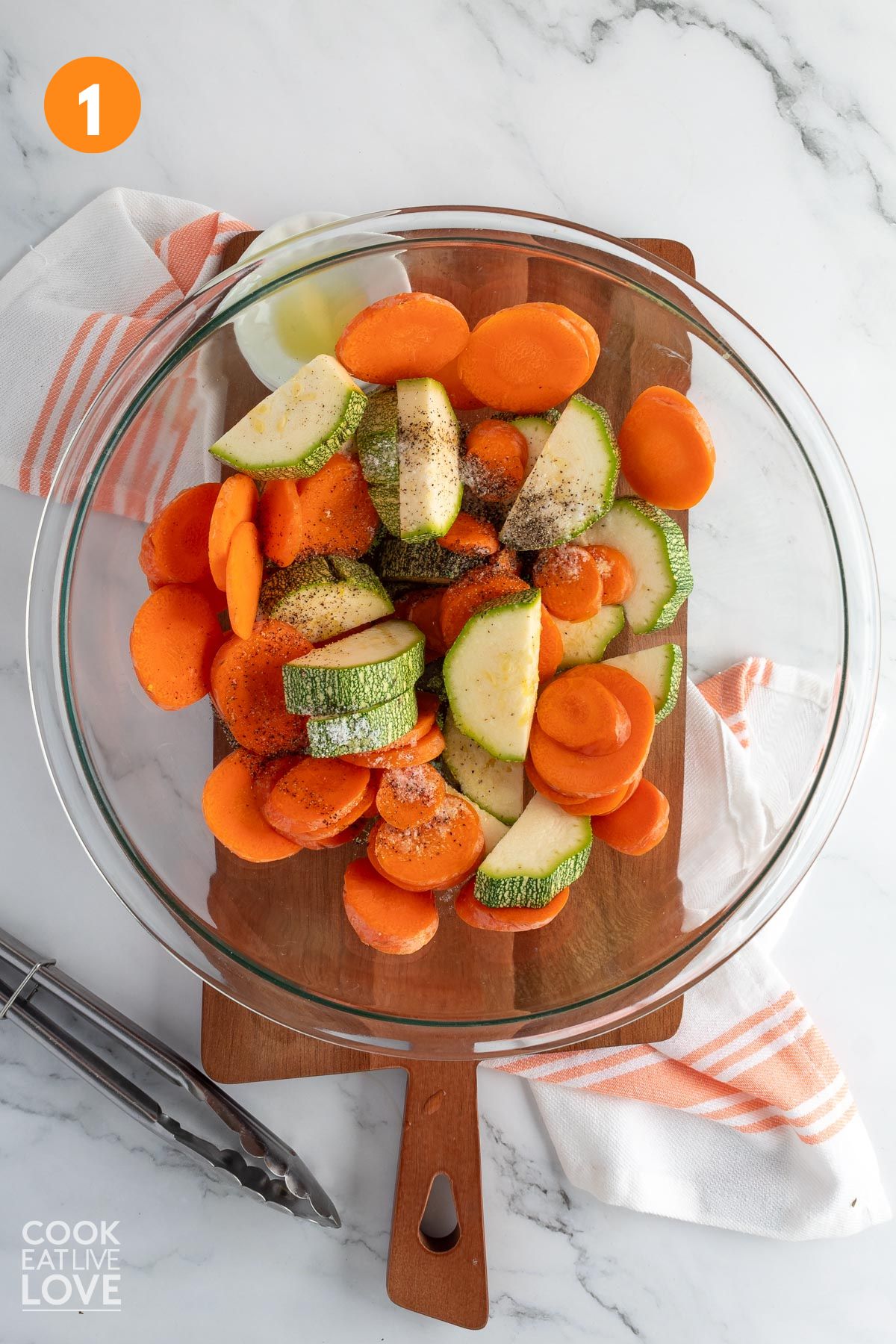 Zucchini and carrots in a large bowl.