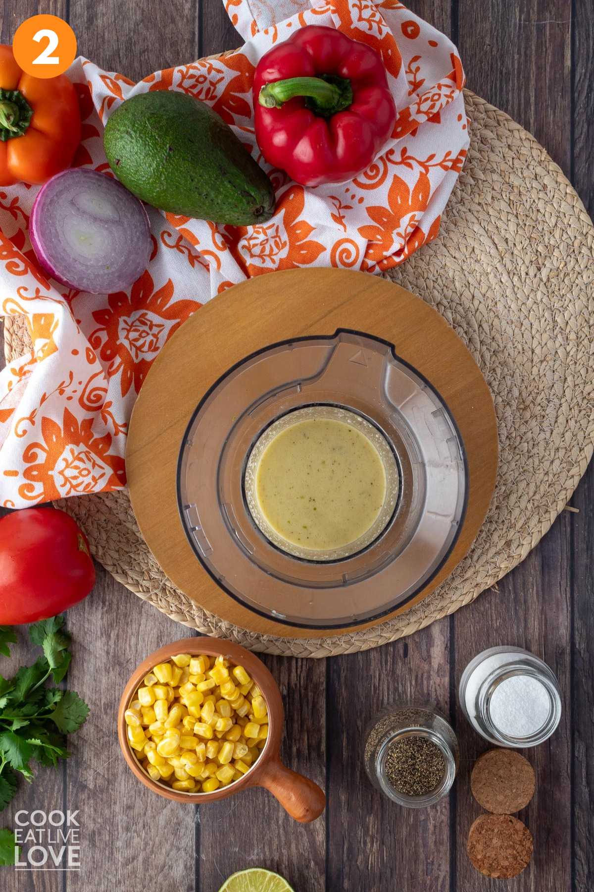 Oil is slowly being added to the dressing and the whisk is stirring in the bowl.