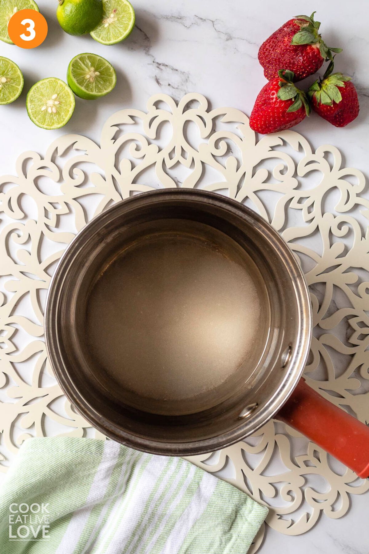 Sugar and water in a saucepan.