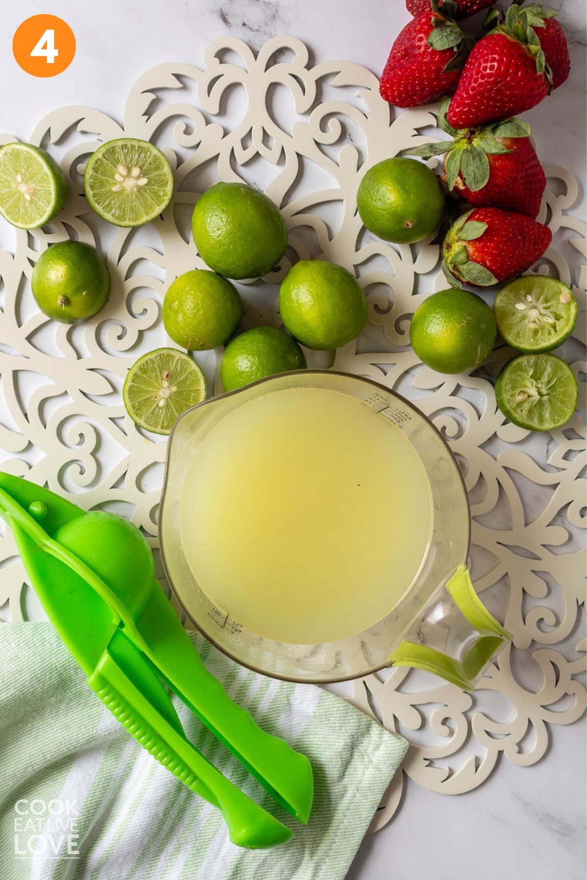Fresh squeezed lime juice in a measuring cup.