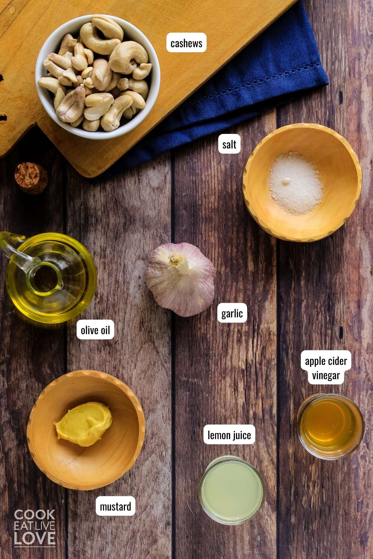 Ingredients to make vegan garlic aioli sauce on the table before mixing.