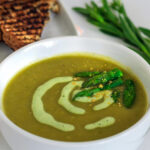 Bowl of vegan asparagus soup on the table