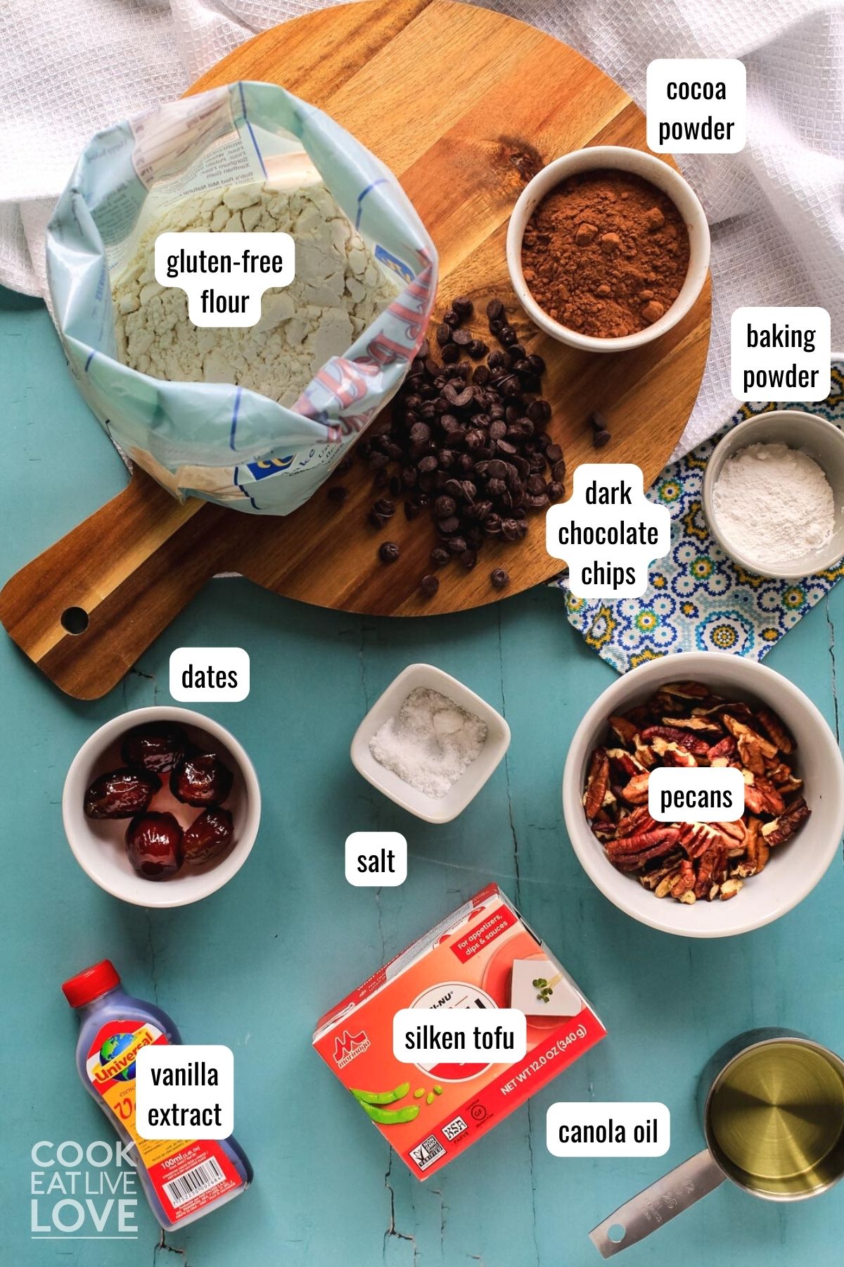 ingredients to make vegan date brownies on table with text labels.