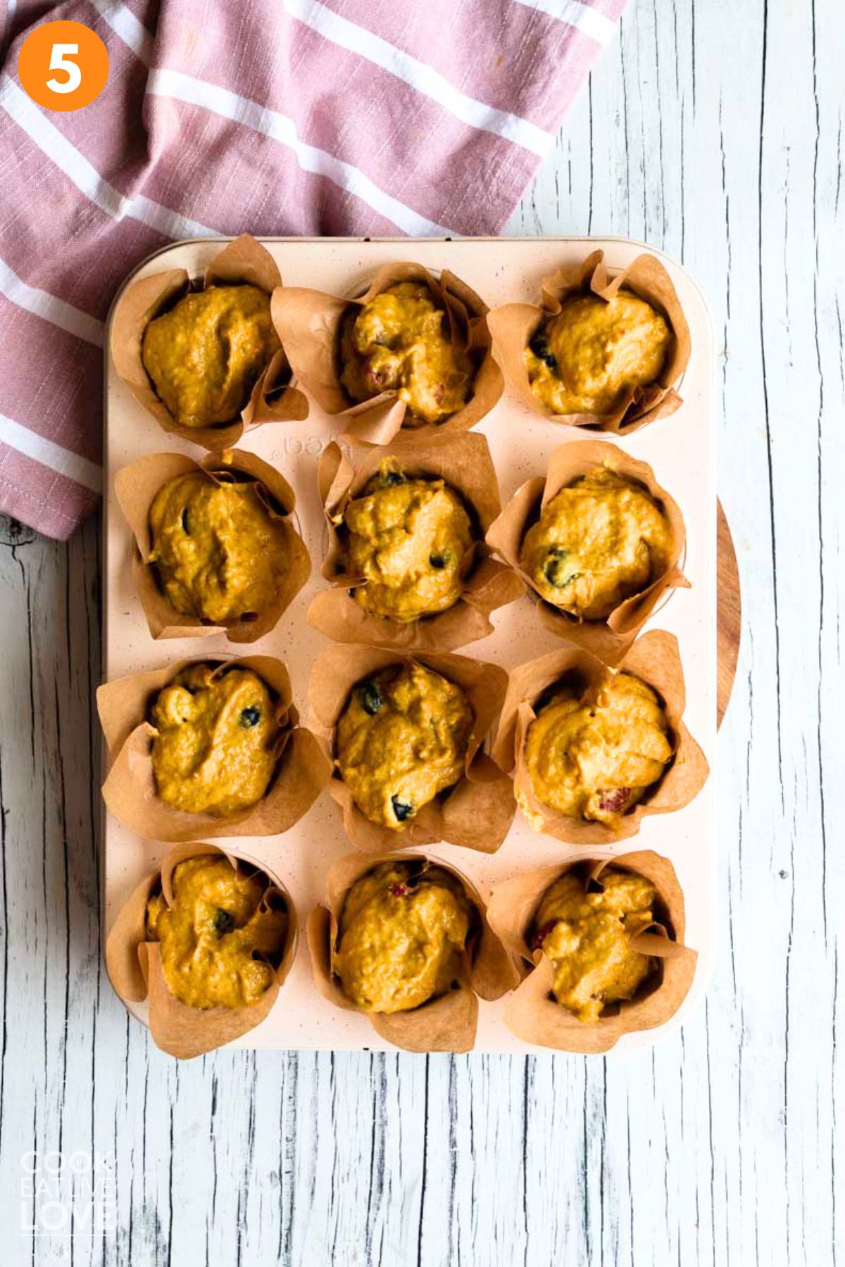 Batter added to muffin pan.