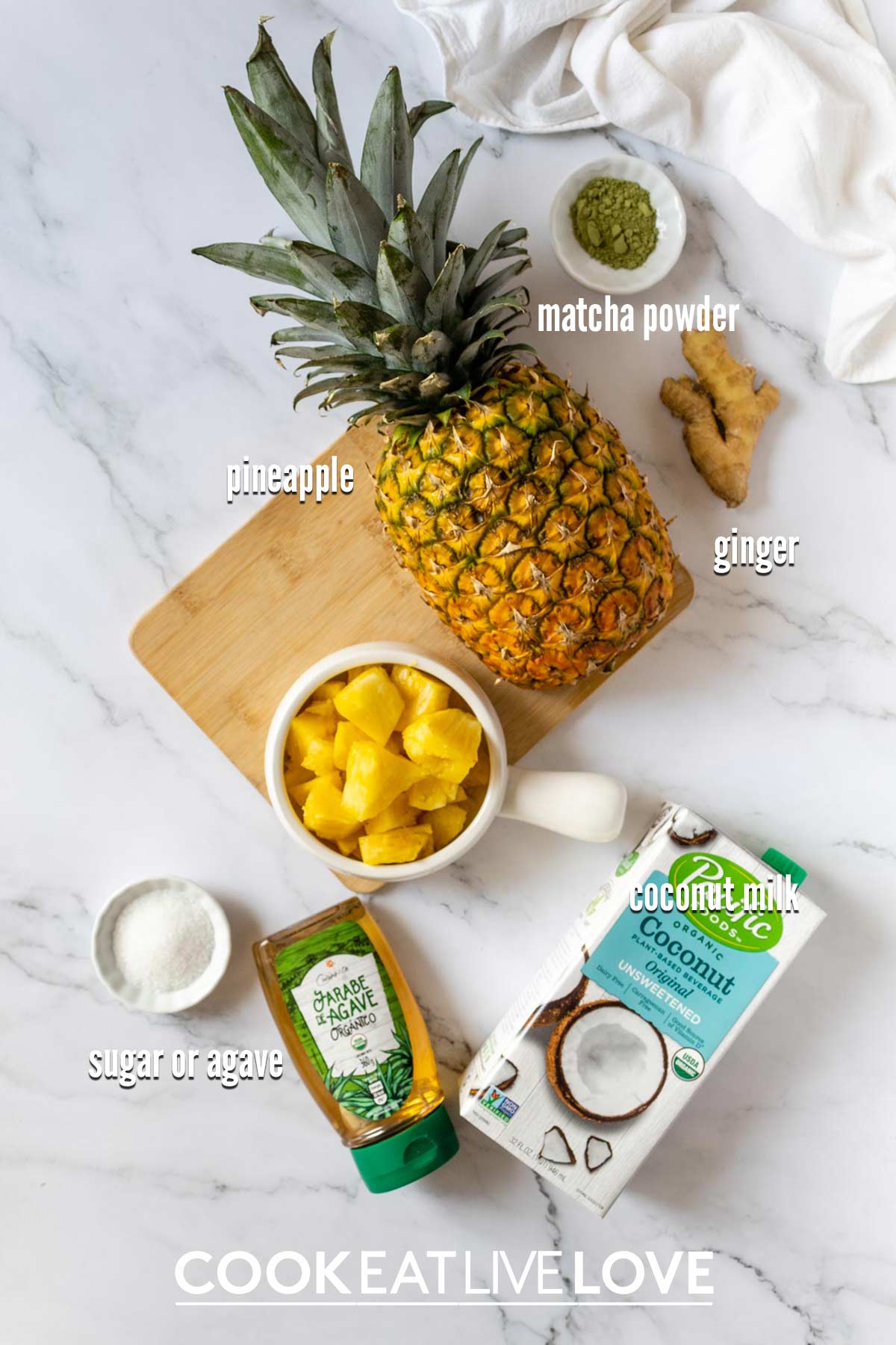 Ingredients in pineapple matcha drink recipe on the table before making it.