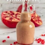 Pin for pinterest graphic with image of pomegranate vinaigrette with text on top.
