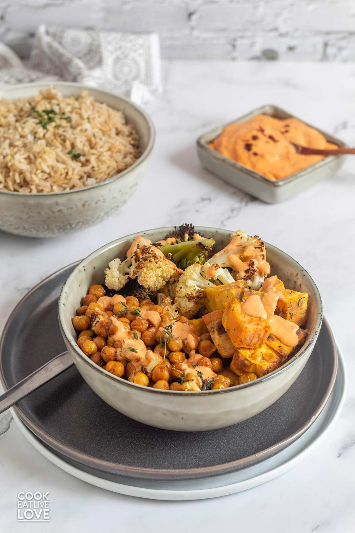 Mediterranean roasted vegetables and chickpeas in a bowl on the table.