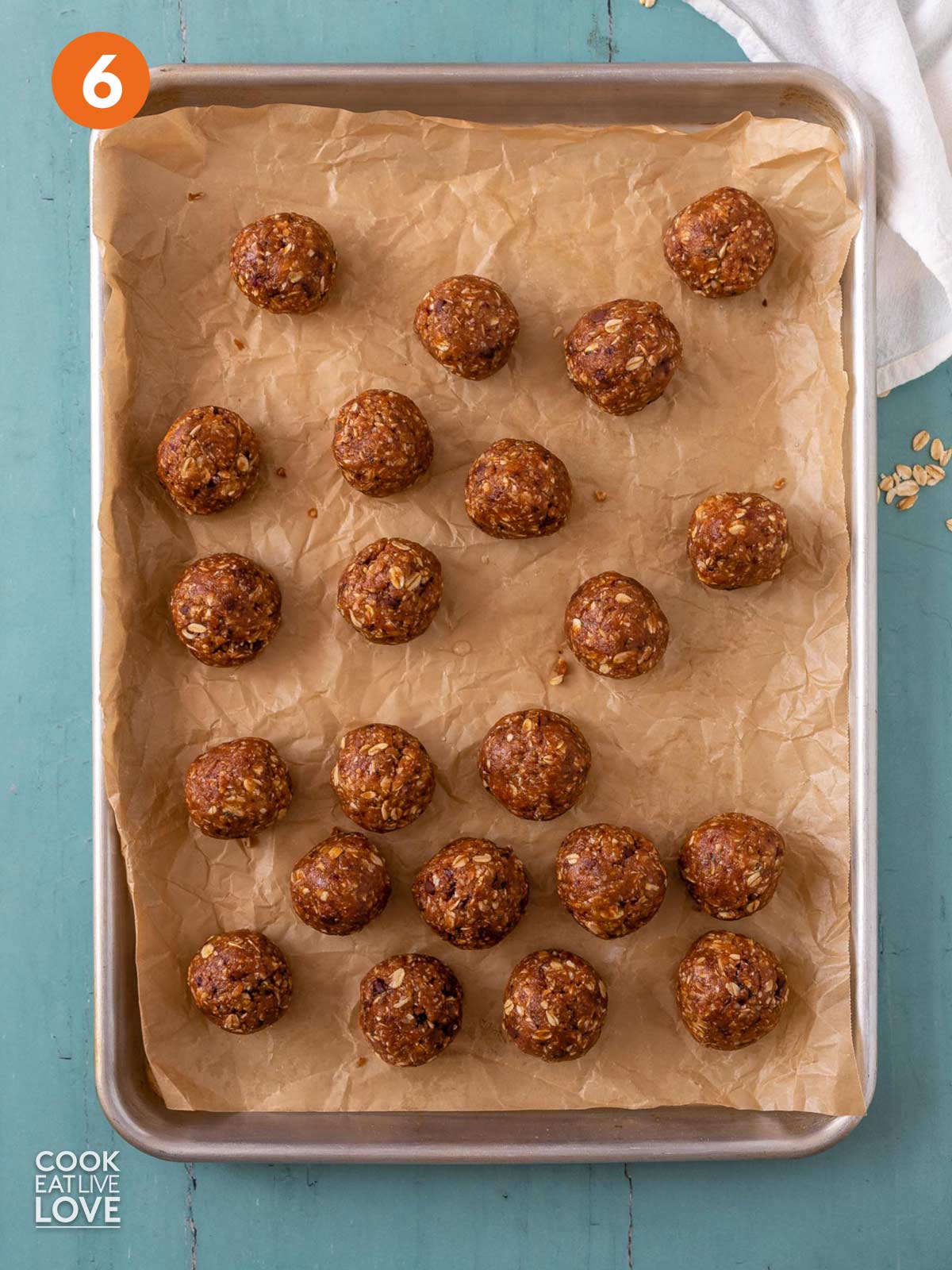 Healthy peanut butter balls laid out on a tray.