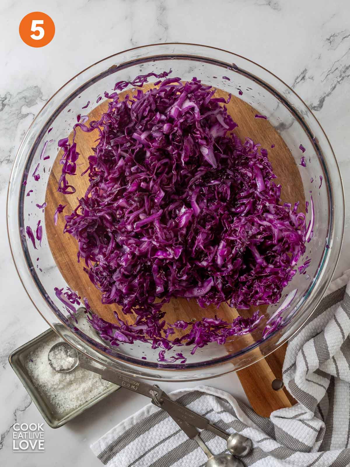 Shredded cabbage in a bowl after massaging.