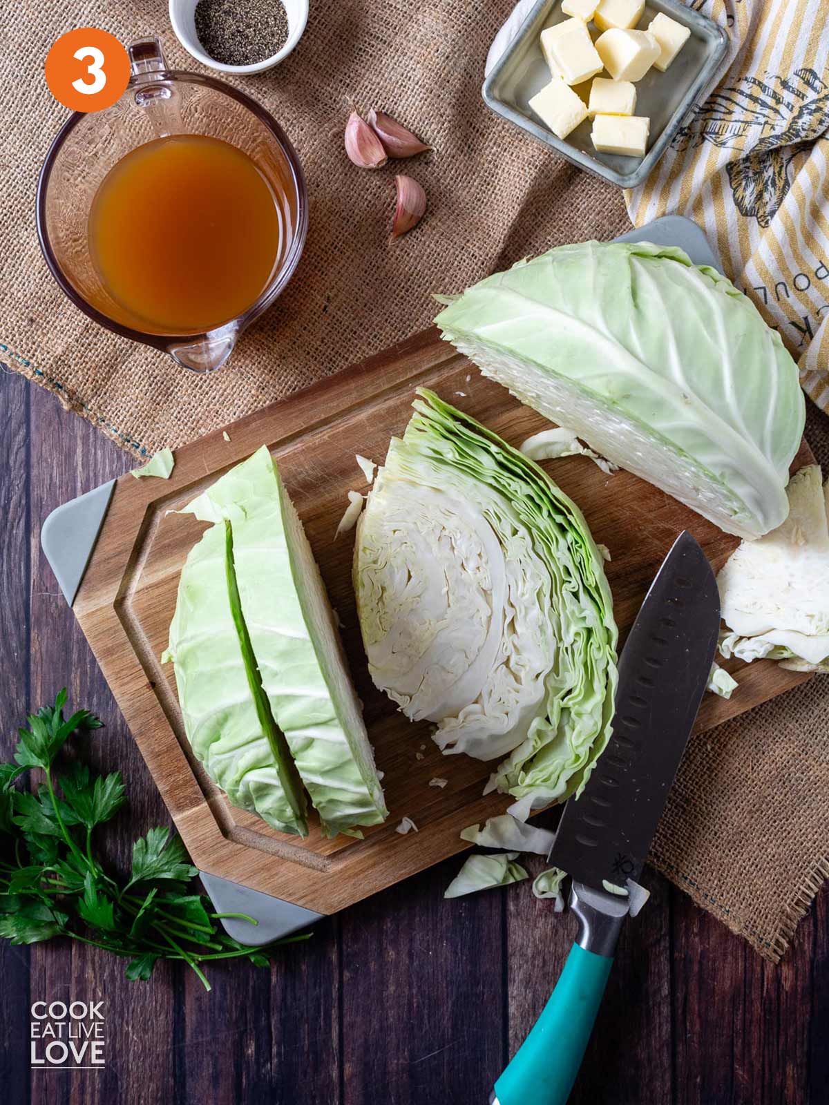 Cabbage cut into slices on a cutting board.