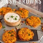 Pin for pinterest graphic with image of sweet potato hash browns on a baking tray with text on top.