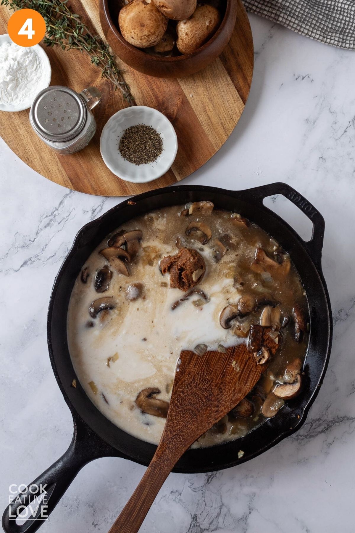 Coconut milk added to the cooked mushrooms.