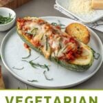 Pin for pinterest graphic with image of vegetarian stuffed zucchini with text on top.