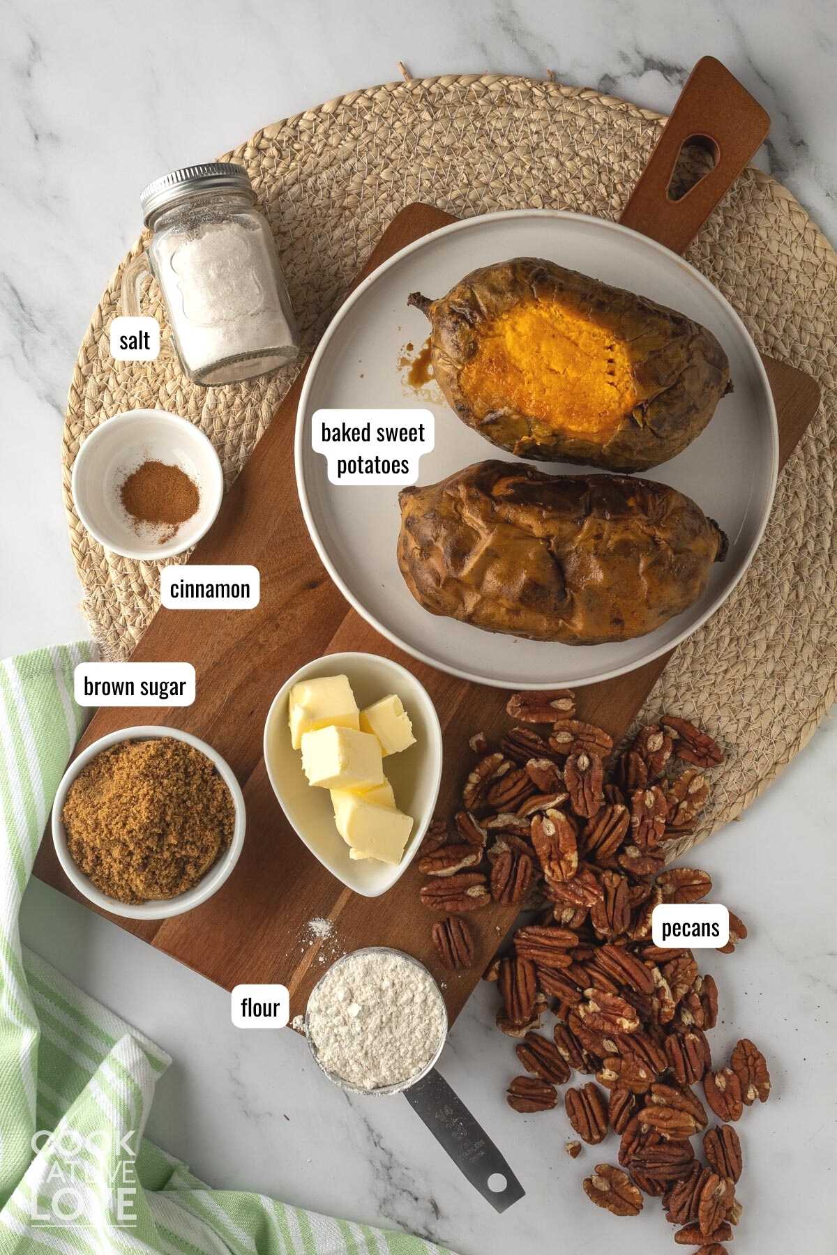 Overhead shot of ingredients needed to make sweet potato casserole with their names listed near them in text boxes.