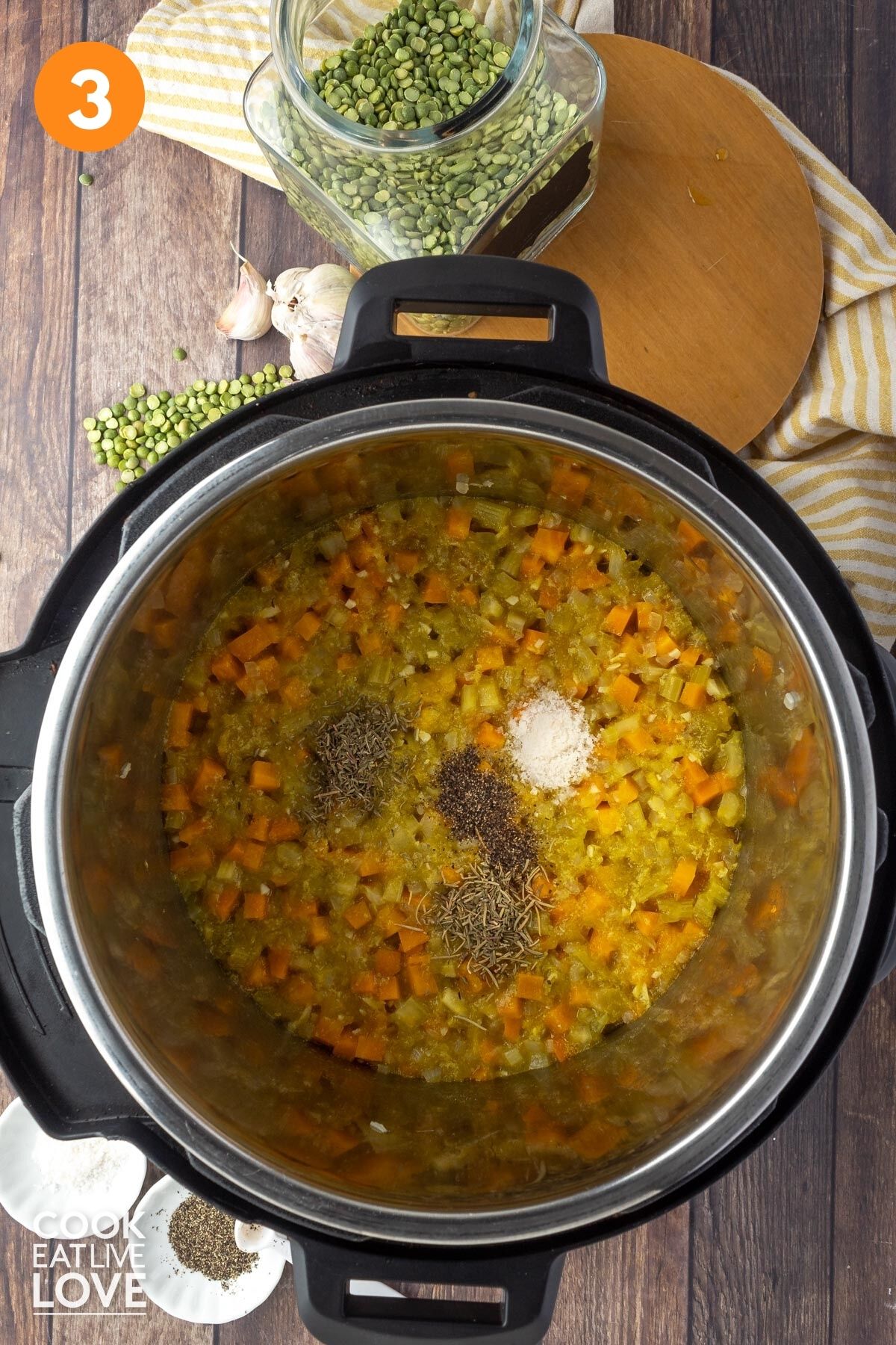 Seasonings added to the veggie, peas, and pumpkin mixture in the instant pot.