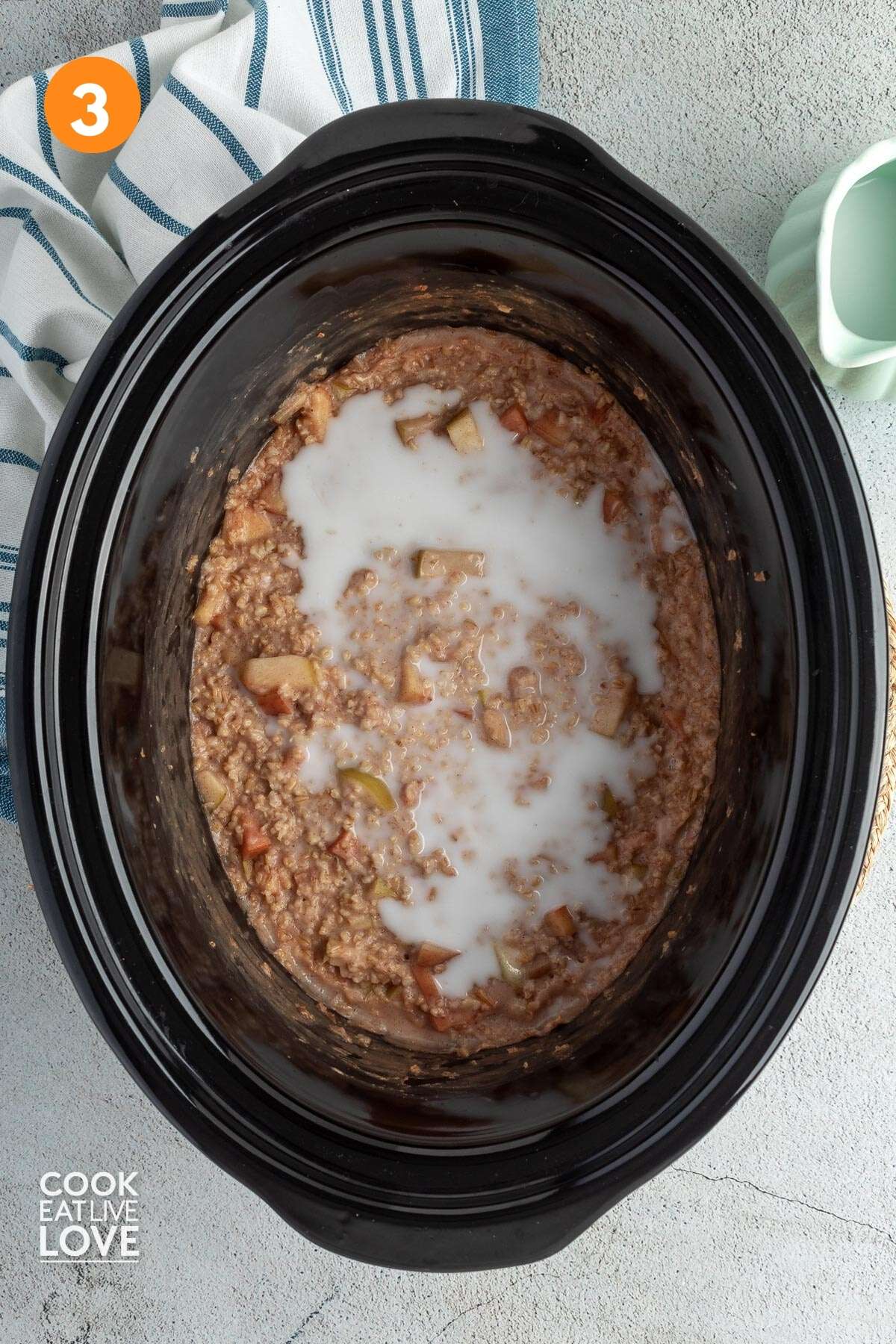 Milk added to the crockpot after the oatmeal is cooked.