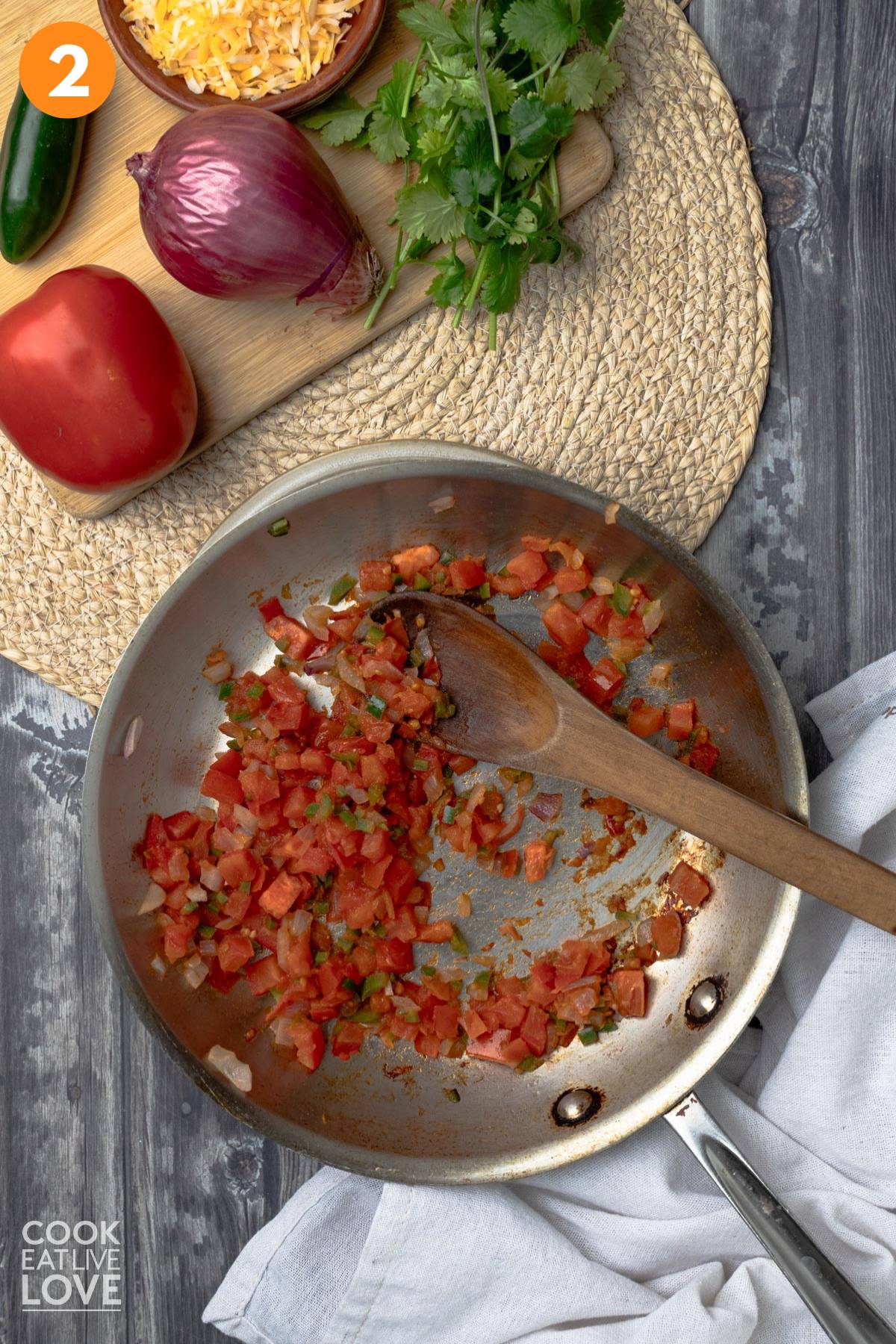 Cooked tomatoes in a skillet.