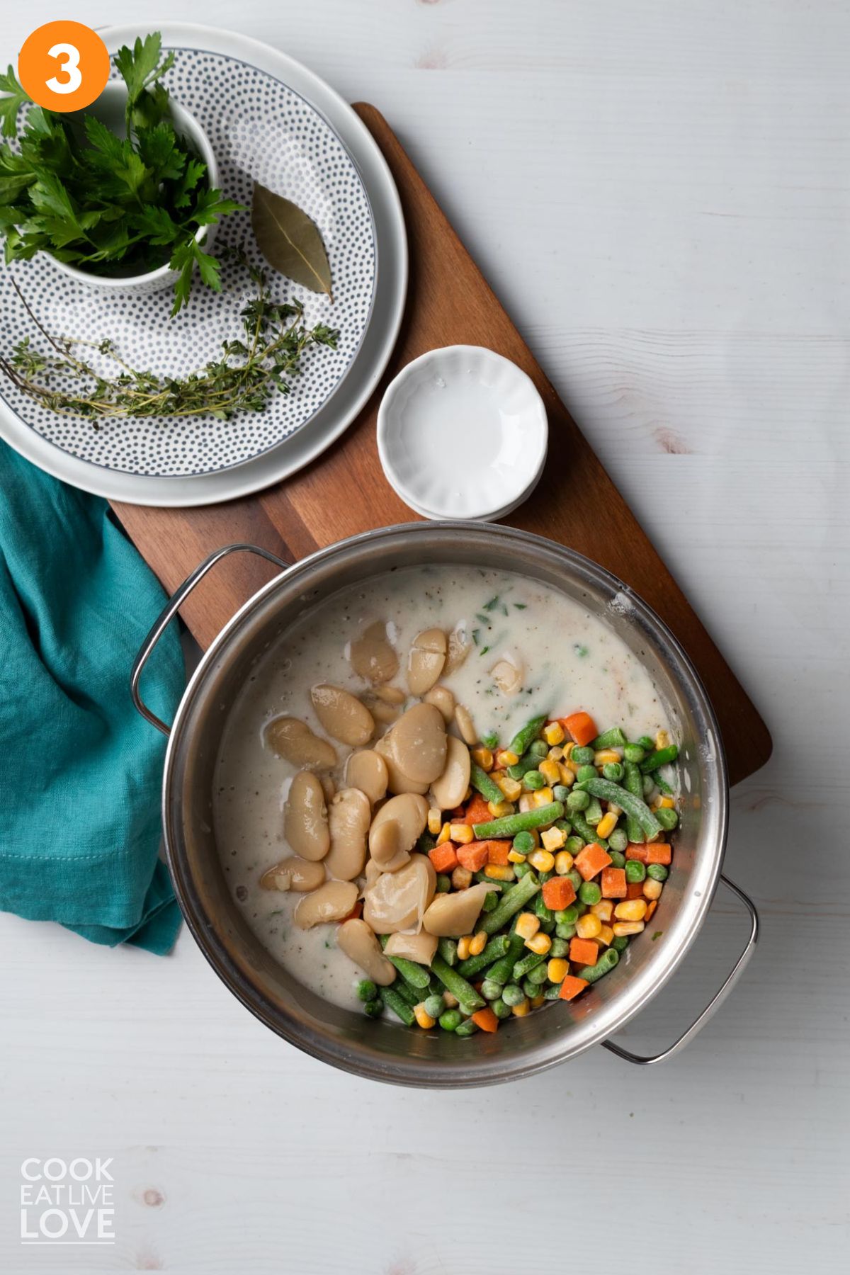 Beans and veggies added to the creamy gravy.